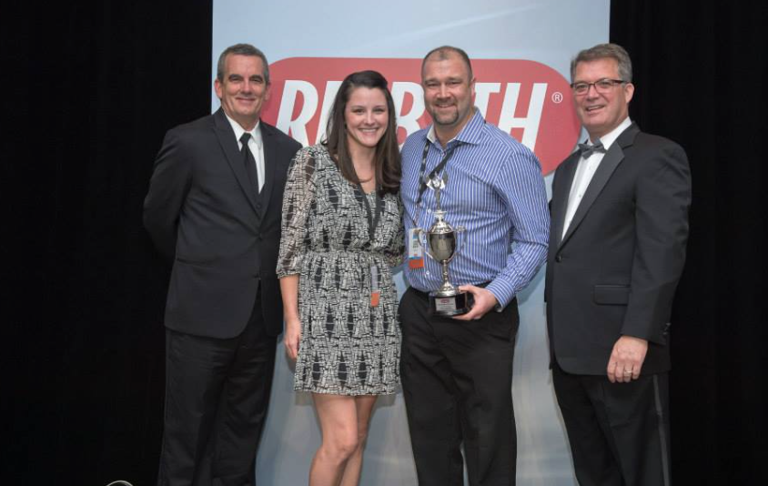 couple presented with trophy