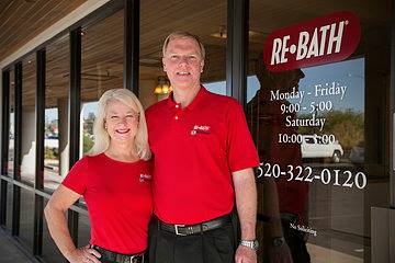 two people wearing red re-bath shirts