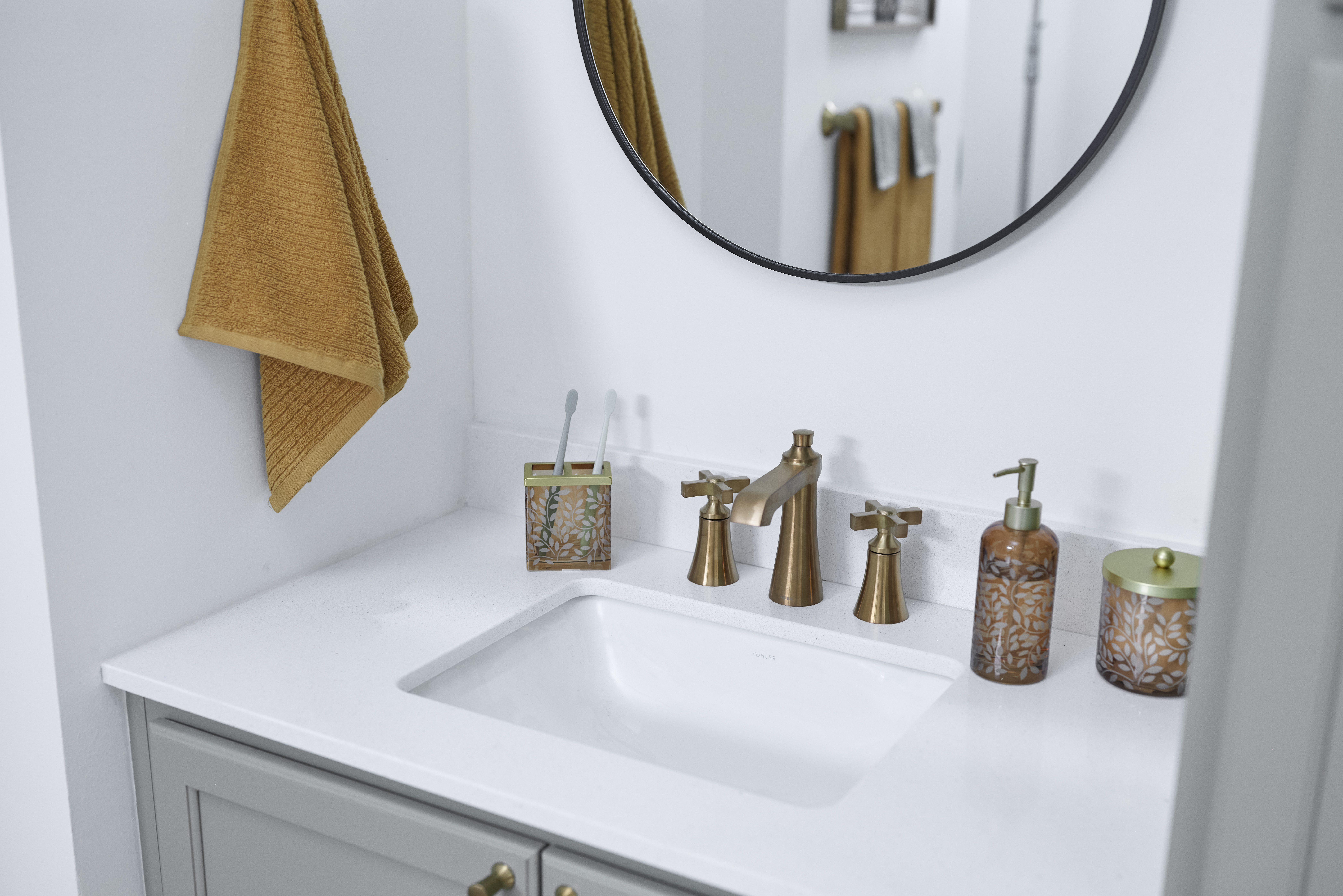 Quartz Countertop with Brushed Gold Faucet Photo